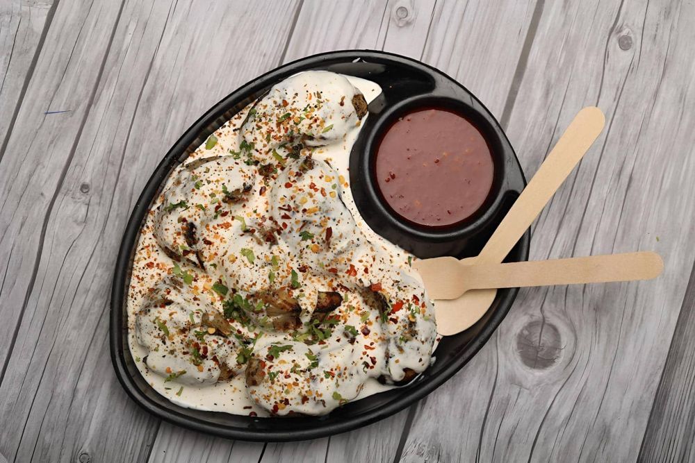 Masala Afghani momos in creamy gravy