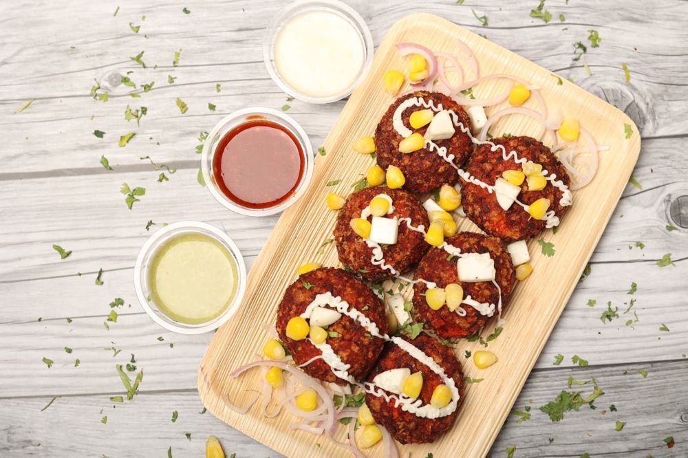 Paneer cheese kurkure momos topped with corn